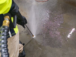 Up close with Zavvers' high-pressure cleaning, showcasing precision as dirt is washed away from a Perth location, emphasizing cleanliness and care.