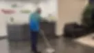 Zavvers Office Cleaner mopping the floor of a reception area of a perth office