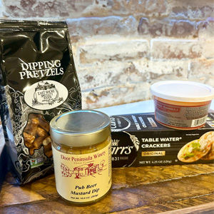 Door County Snacks, cheese spread, crackers and mustard dip.
