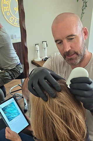 Russ Nicholson, The Scalp Stylist, carrying out an AI Hair Health Scan at HeadStrong Clinic Cheltenham