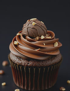 chocolate cupcake with white icing on wh