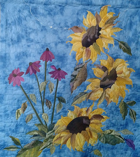 Sunflowers and coneflowers on a blue background