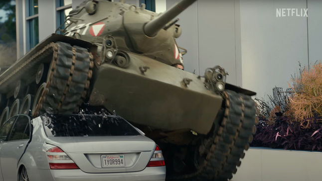 Military tank picture car crushing a sedan on a Netflix film production set provided by Malibu Autobahn Picture Cars