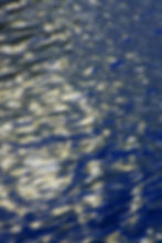 Layered photos of scattered sunlight projecting onto water, has created this collage.