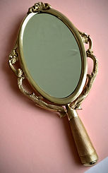 hand-held vintage mirror