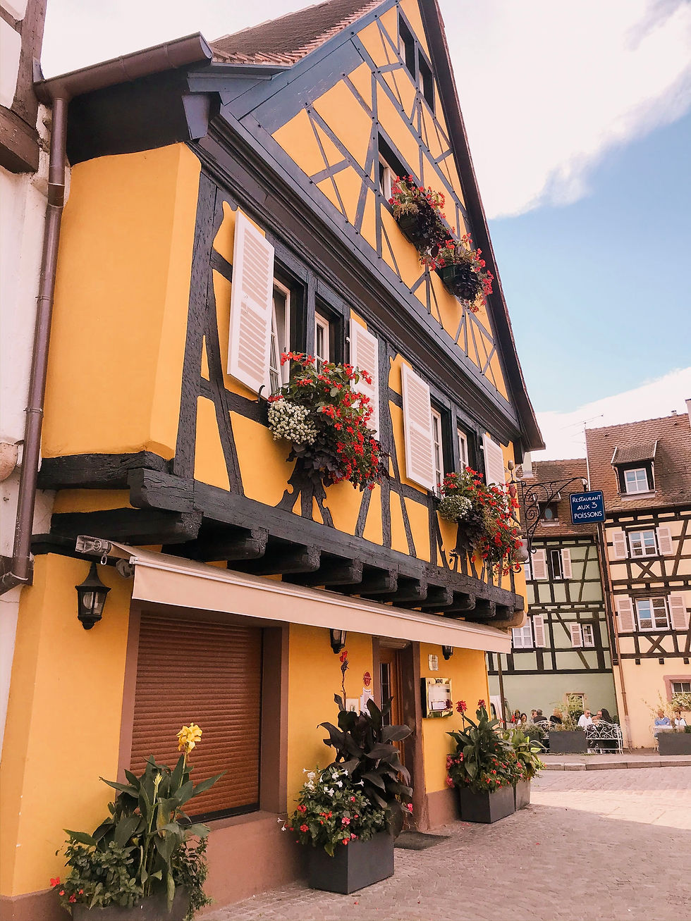 Classic quaint yellow house in Colmar, the Alsace region of France