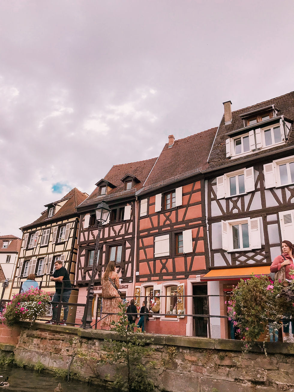 View of Colmar's iconic colourful buildings from the water in Colmar, the Alsace region of France