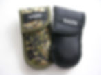 Thumbnail: NATO® Tactical Camo / Black Pouch with NATO logo, shown beside a folding knife and sunglasses on military gear.