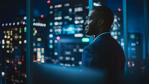 young black executive looking out the window.jpeg