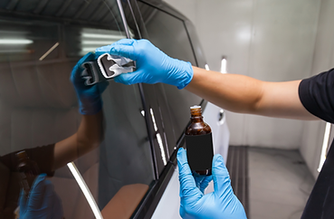 Automotive glass treated with Ceramic Pro Glass, displaying crystal clear visibility and hydrophobic properties that repel water and dirt