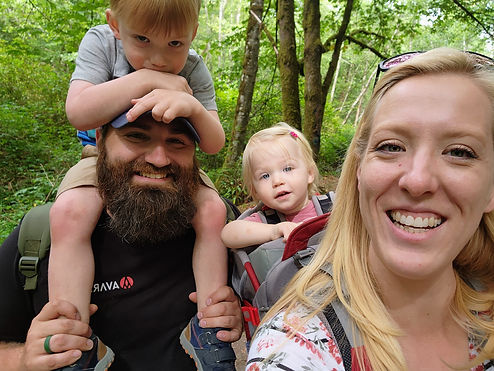 A picture of Dr. Serena, her husband, her son and daughter on a hike