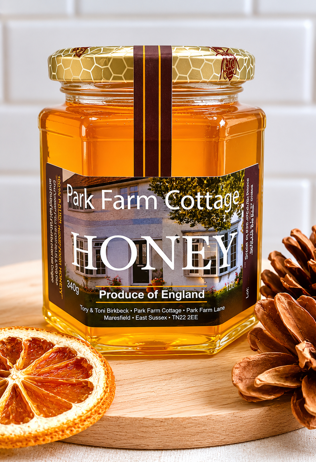 A glass jar filled with rich raw local honey placed on a rustic wooden table.