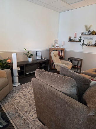 Northlight Counseling office with a sofa, armchair and warm lighting