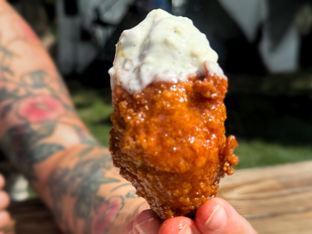 chicken wing dipped in blue cheese
