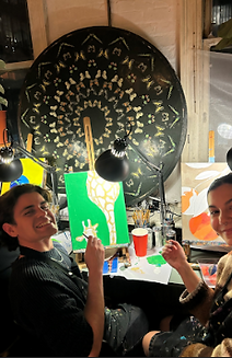 Friends celebrating birthday with painting workshop in London