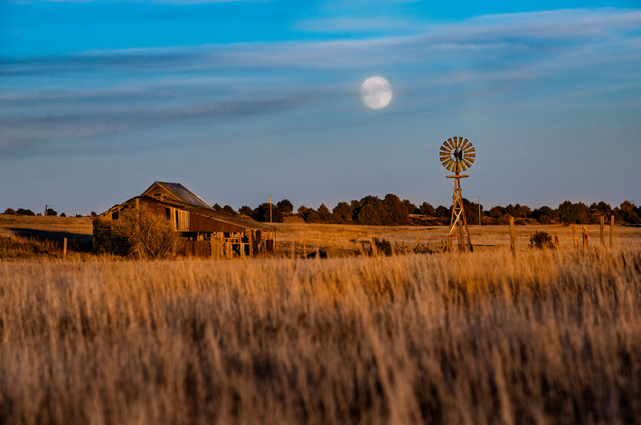 Pioneer Barns and Windmills at Moon Rise