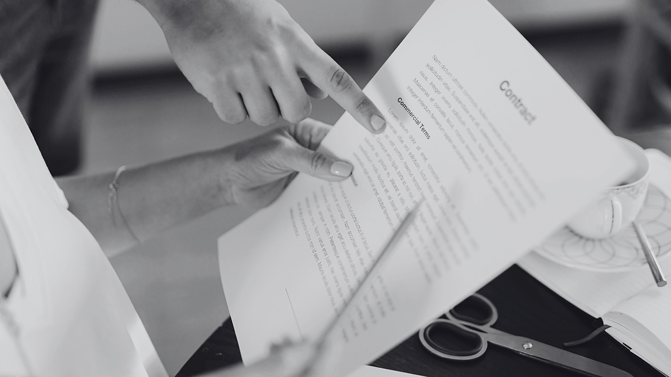 Two people looking over a contract.