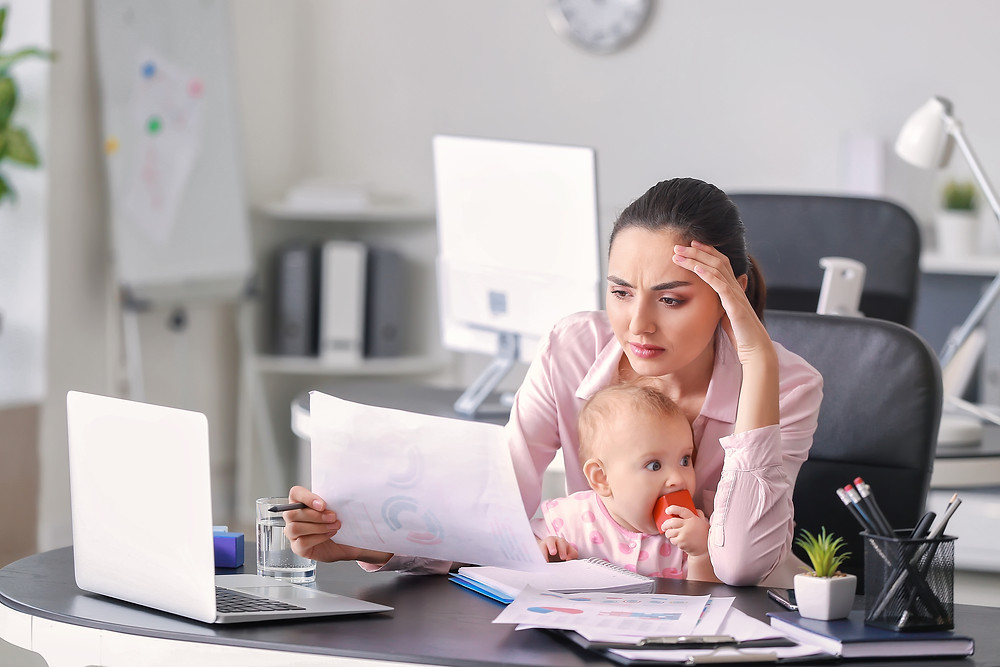 stressed mom trying to work