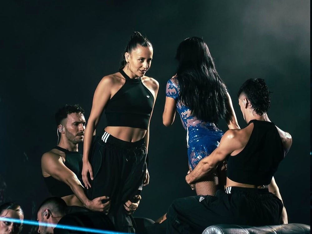 Two women and two men performing on stage
