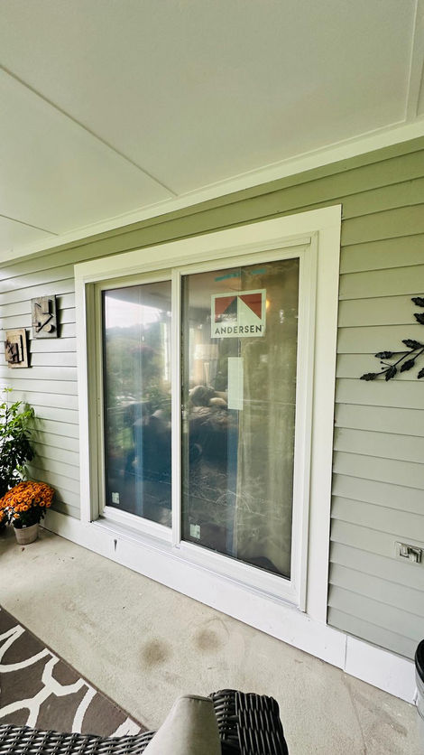 Sliding glass door on a house exterior wall.