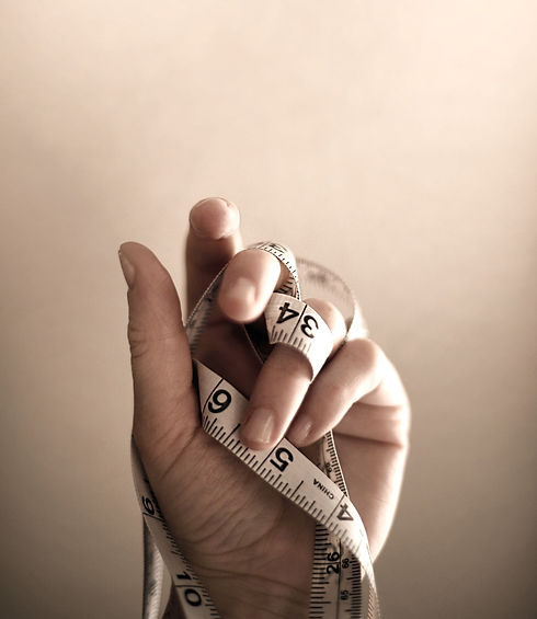 Hand med måttband