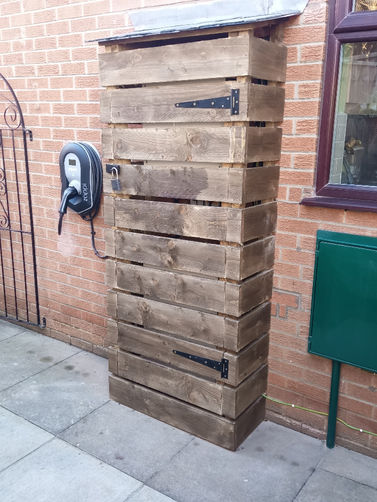 Branston - Lincolnshire, PV with battery storage, shelter built for inverter and batteries as situated outside.