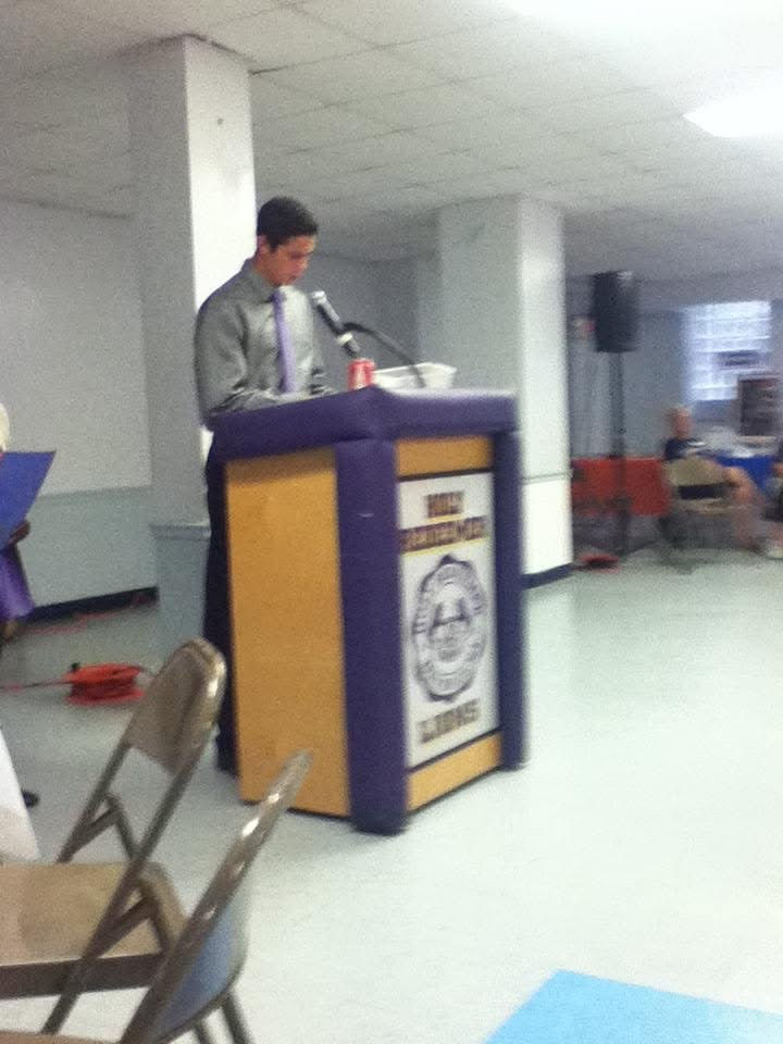 Christian giving a speech in the church basement.