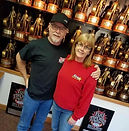 George and Jackie Bryce of Star Racing pose with a few of their many NHRA trophies from the past 4 decades.