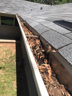 Screen Gutters Before by ametex roofing waco texas