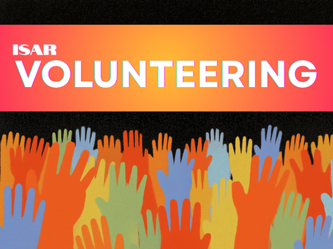 Hands raised to volunteer for an astrology organization
