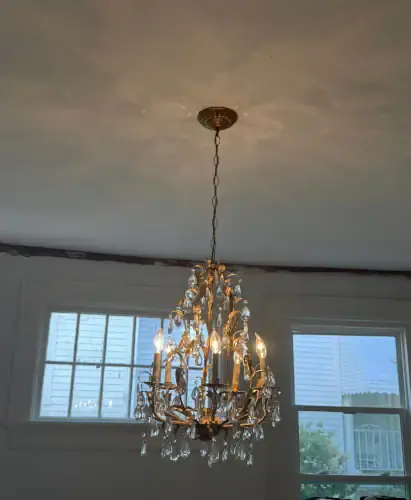 install chandelier in old home remodel_.webp