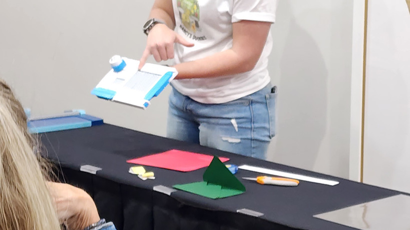 Makayla demo-ing the envelope maker.jpg