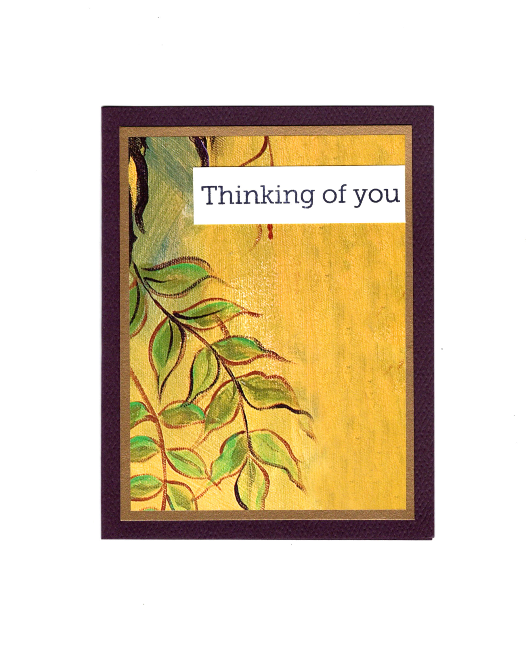 Purple, gold and yellow card with green leaves on the front