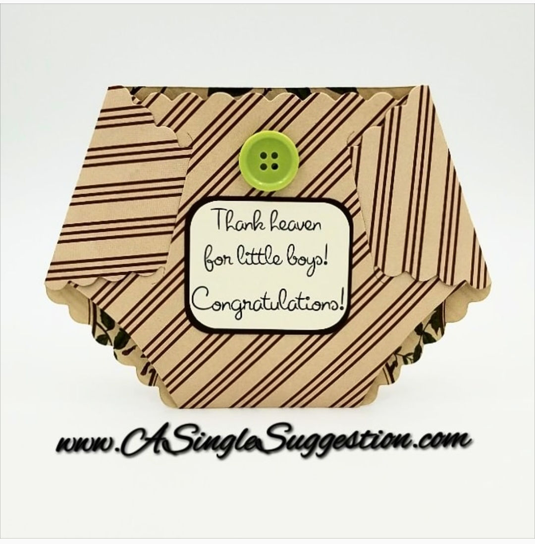 Note card shaped like a diaper with a green button on the front.