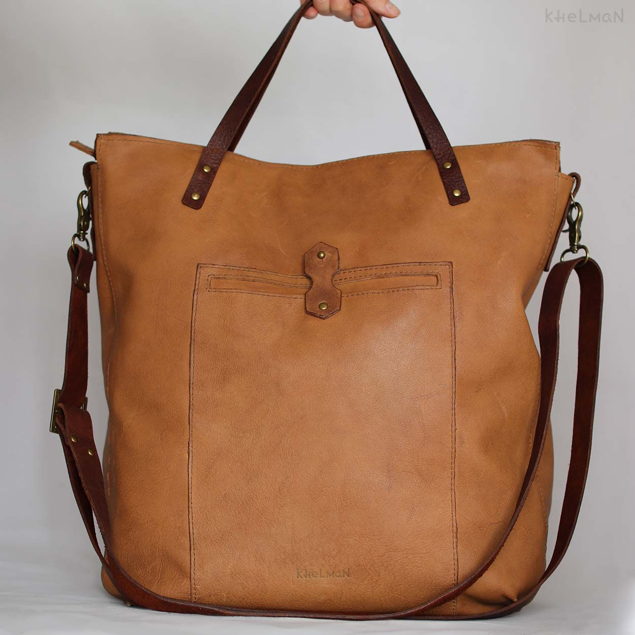 The bag has a long leather cross body strap