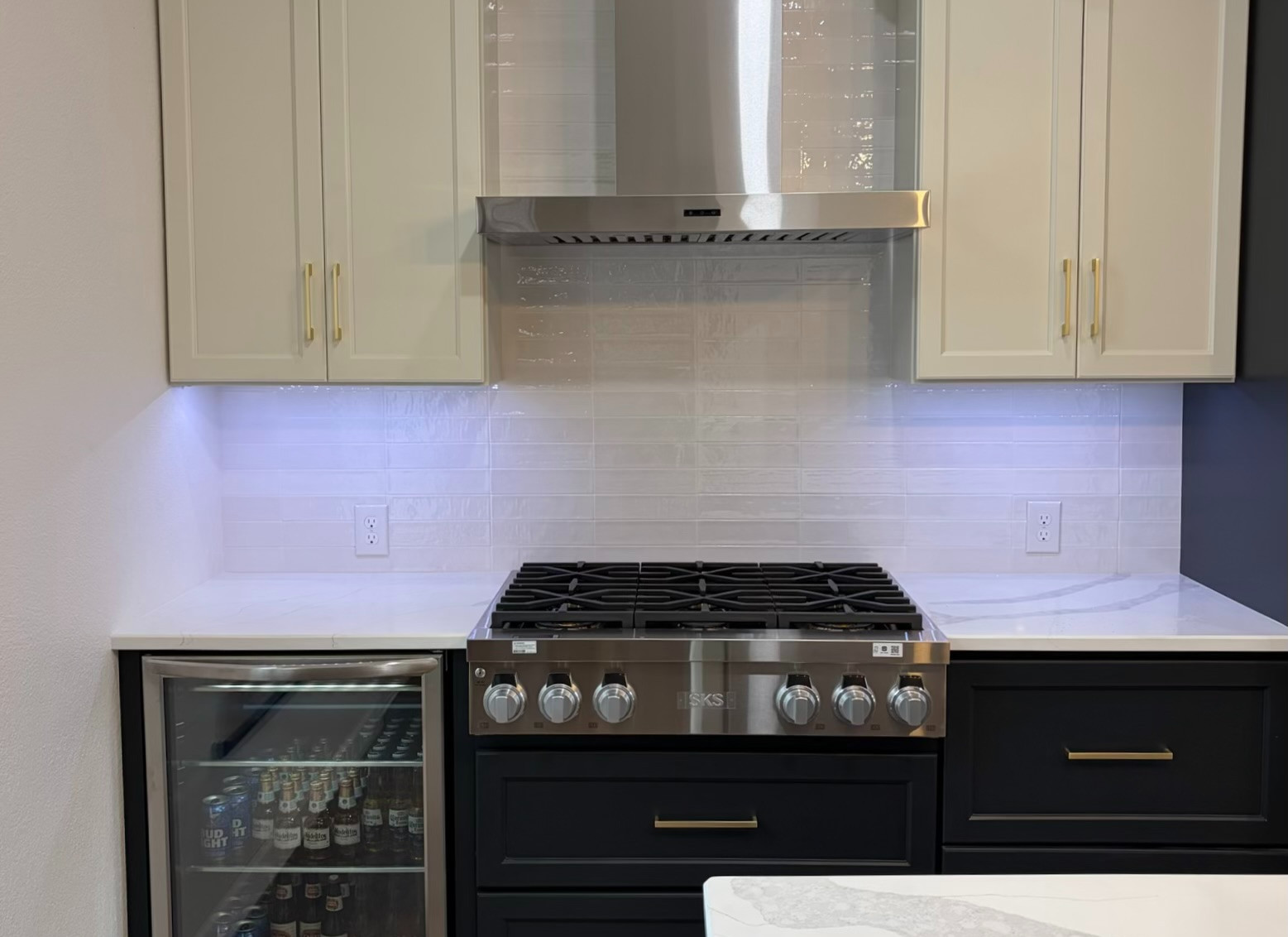 Kitchen remodel with a new backsplash, countertops, cabinets and appliances in Garland, TX