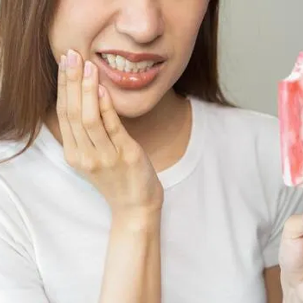 Why Are My Teeth Sensitive? Causes, Treatment & Prevention