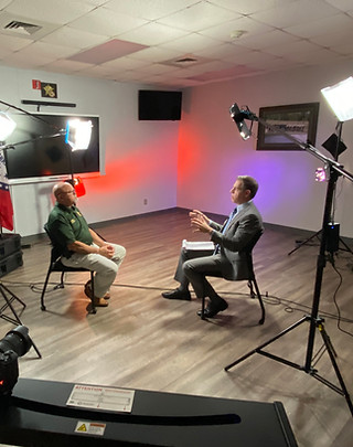 Mark Albert interviewing a sheriff about Chinese-made drones and law enforcement