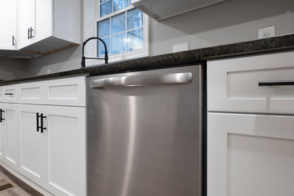 stainless steel dishwasher and white cabinets