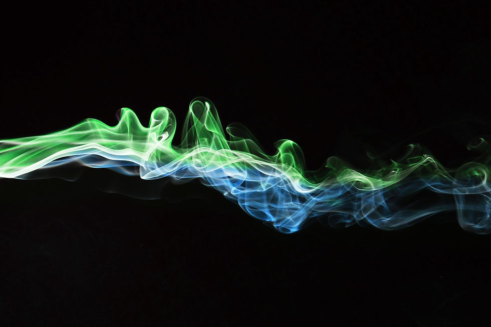 Close-up view of burning sandalwood incense stick with soft smoke
