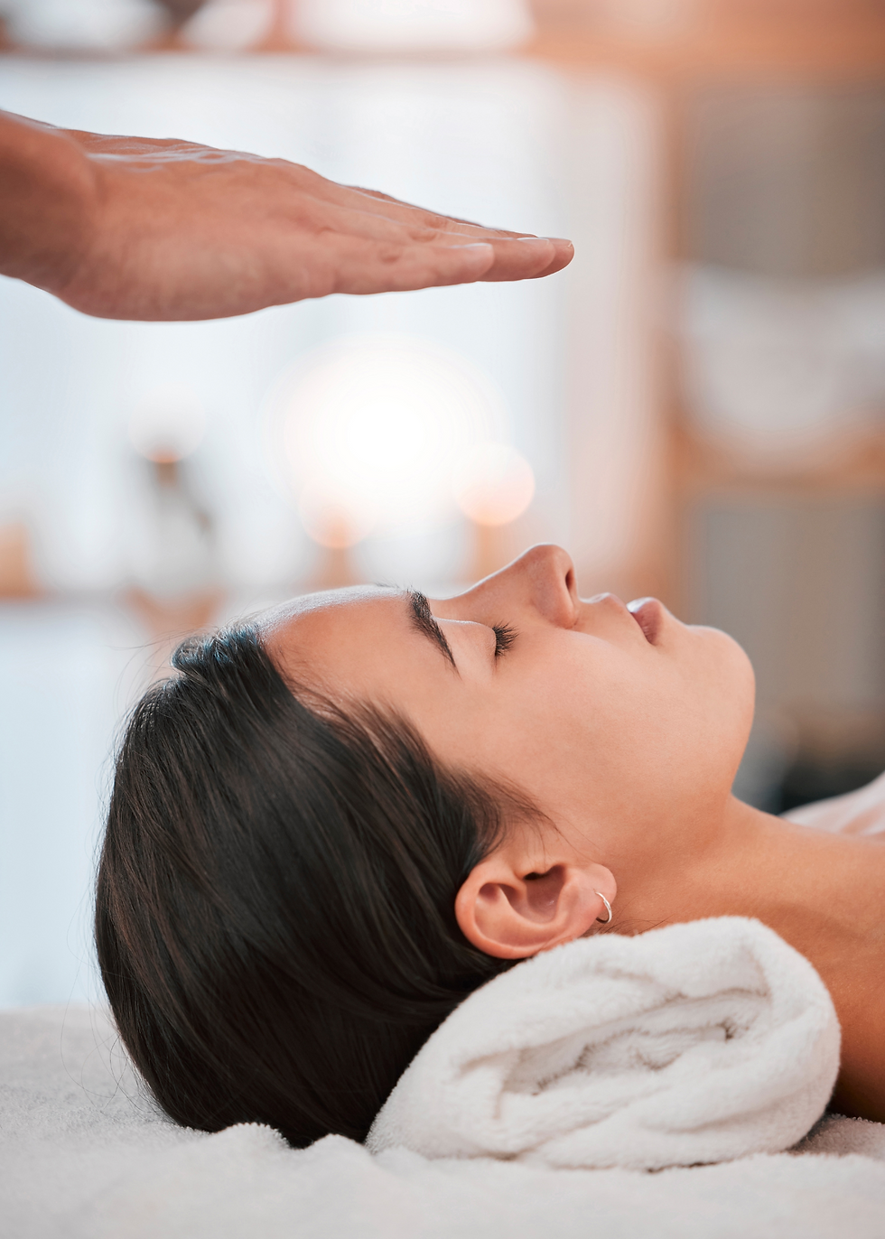 Reiki - energy healing being preformed on client
