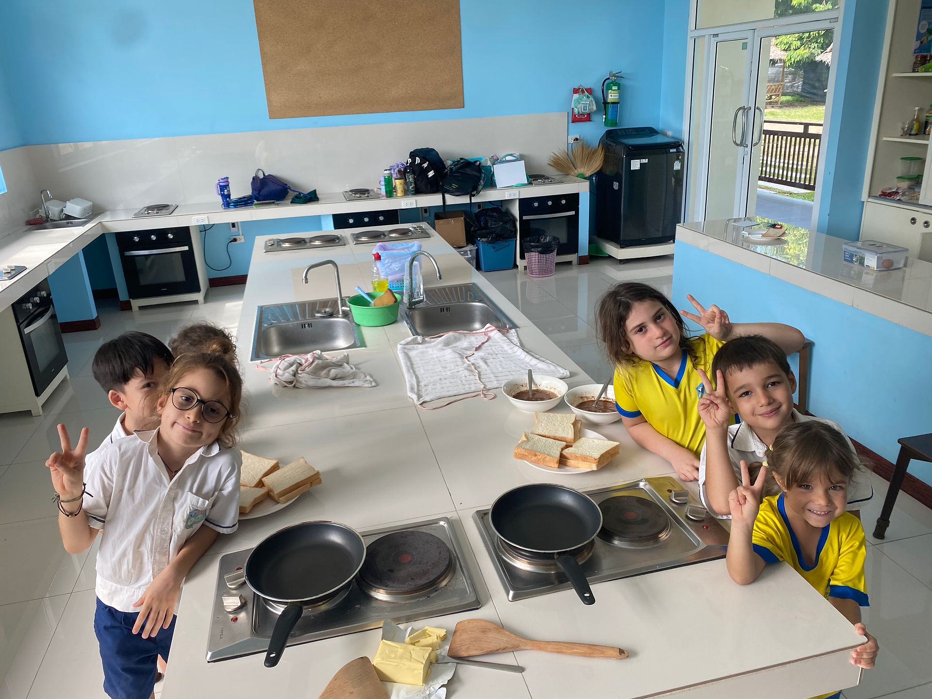Students in a cooking class for Si Ri Panya News Highlights.