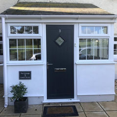 Composite front door installation with uPVC porch completed on residential property in Bridgend, South Wales
