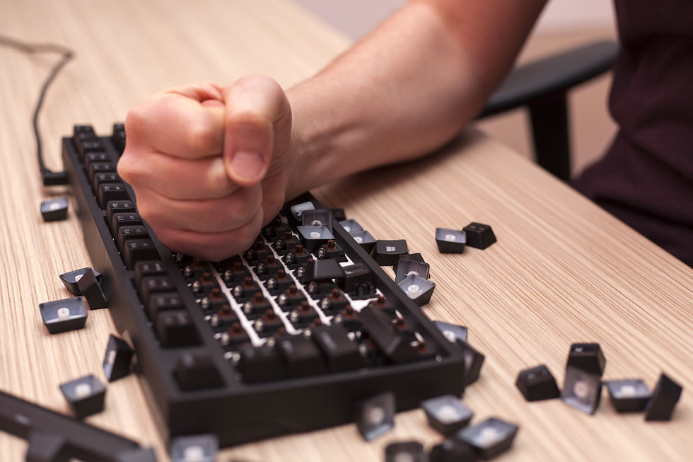 A photo of a fist hitting a keyboard in frustration