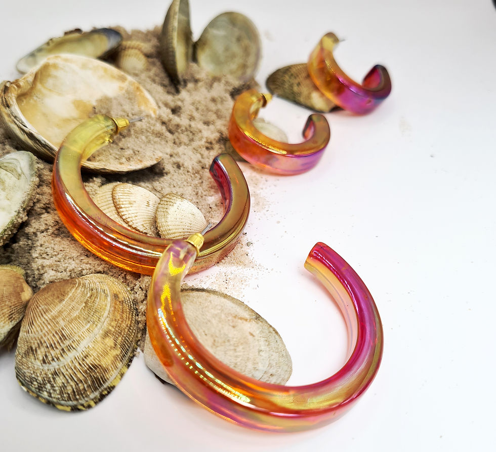 Thumbnail: Bold, chunky iridescent red/yellow hoops.