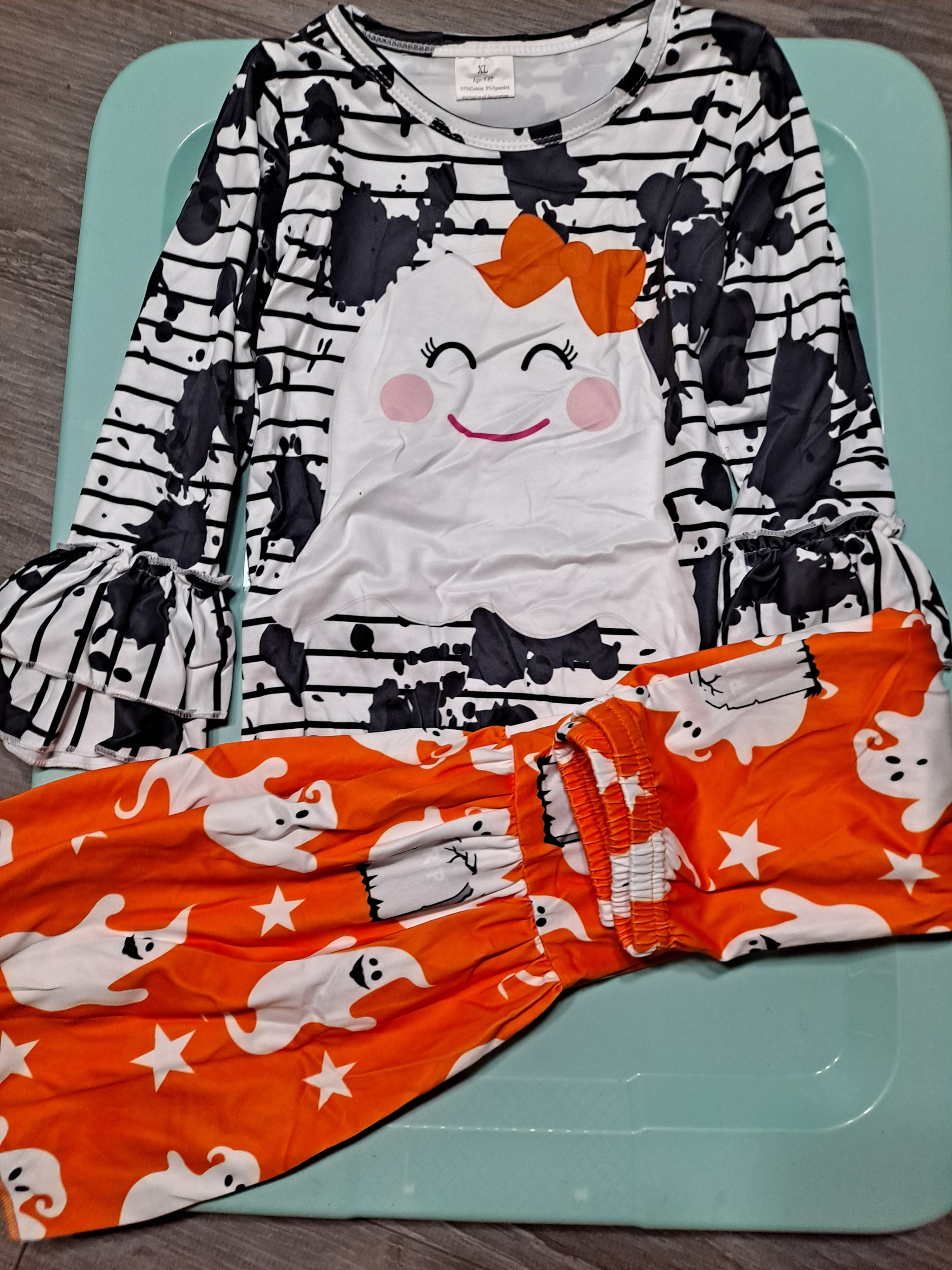 Ghost-black & white top, orange pants