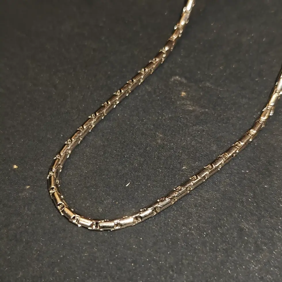 Long silver-tone men's chain with a sleek geometric link pattern, designed for a clean and modern everyday look.