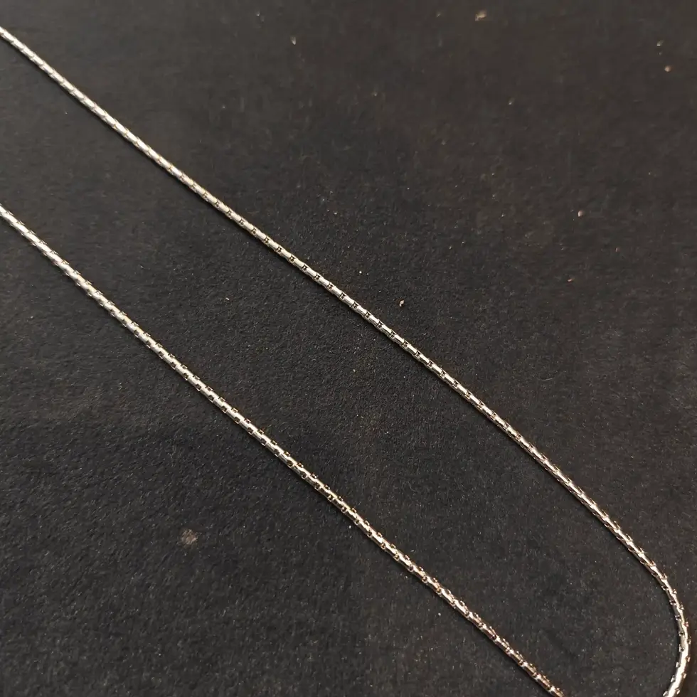 Long silver-tone men's chain with a sleek box-link design, offering a clean and minimal everyday look.