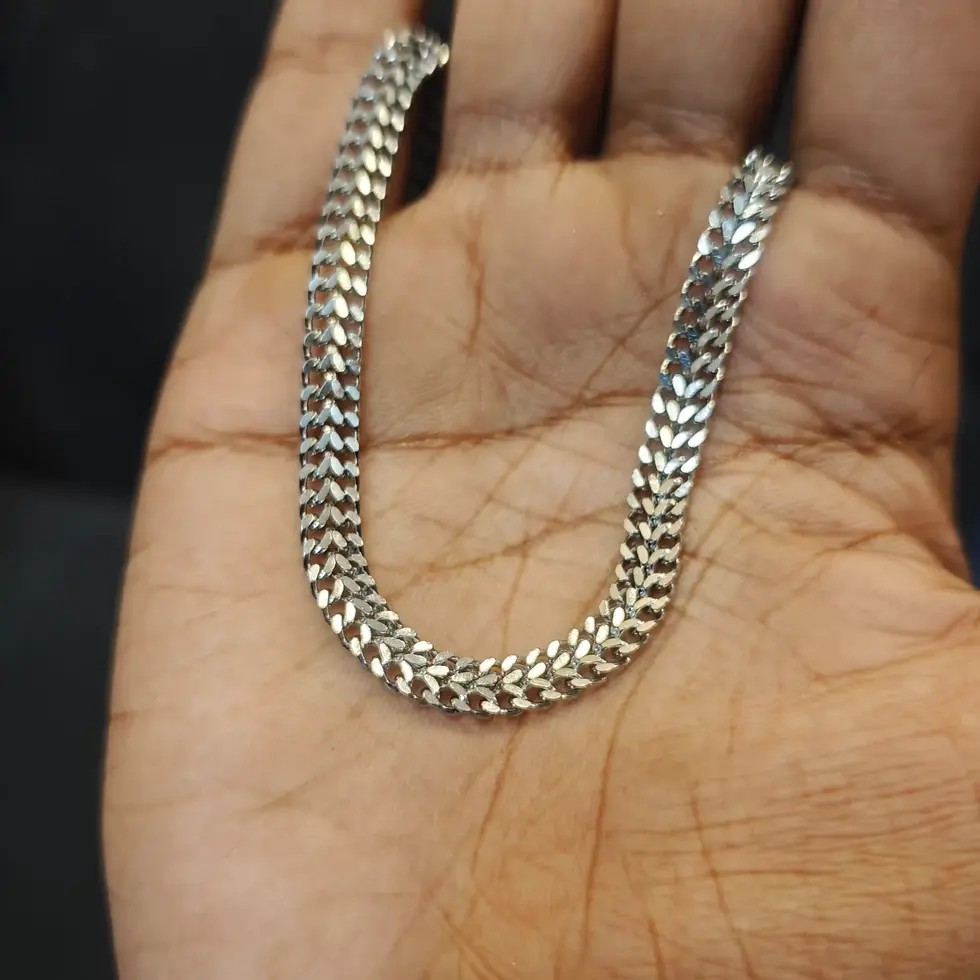 Long silver-tone men's curb chain with a bold flat-link design, perfect for making a clean everyday statement.