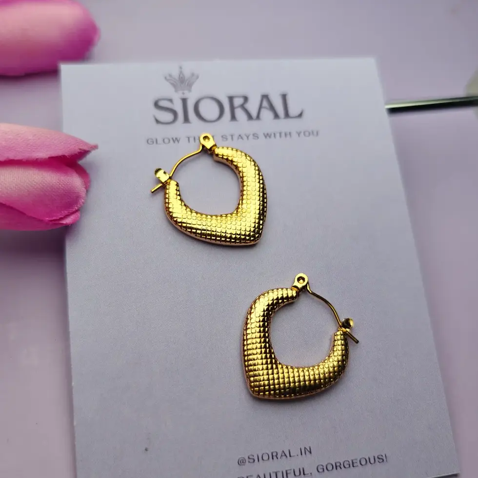 Bold gold hoop earrings for power dressing and statement looks